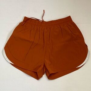 Alphalete Infinity Stride Shorts in Orange Womens Size L